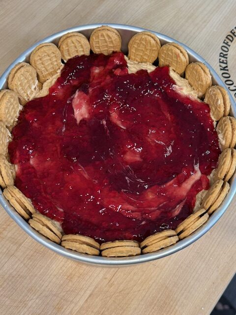 Half of the no bake mixture with jelly on top and topped with second half of the cheesecake mixture.