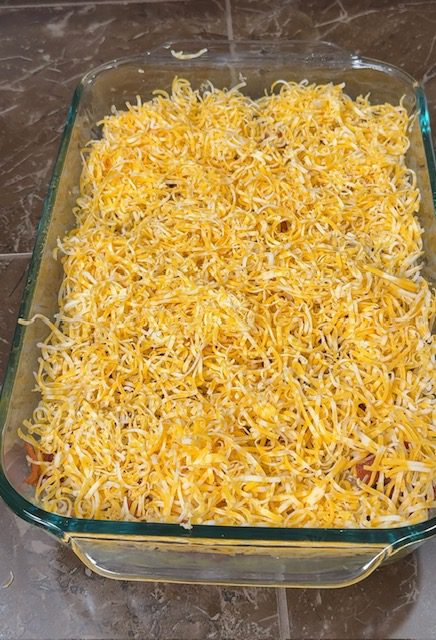 Colby Jack cheese seen on ingredients in glass baking dish.