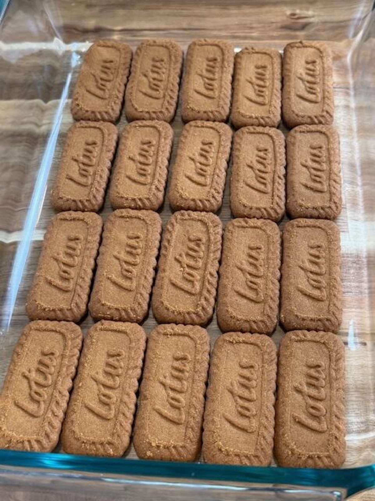Biscoff cookies and lined up in a 9x13 glass baking dish.