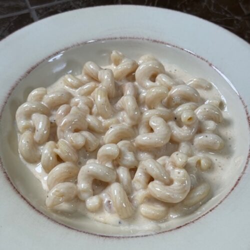 A bowl of finished slow cooker mac and cheese.