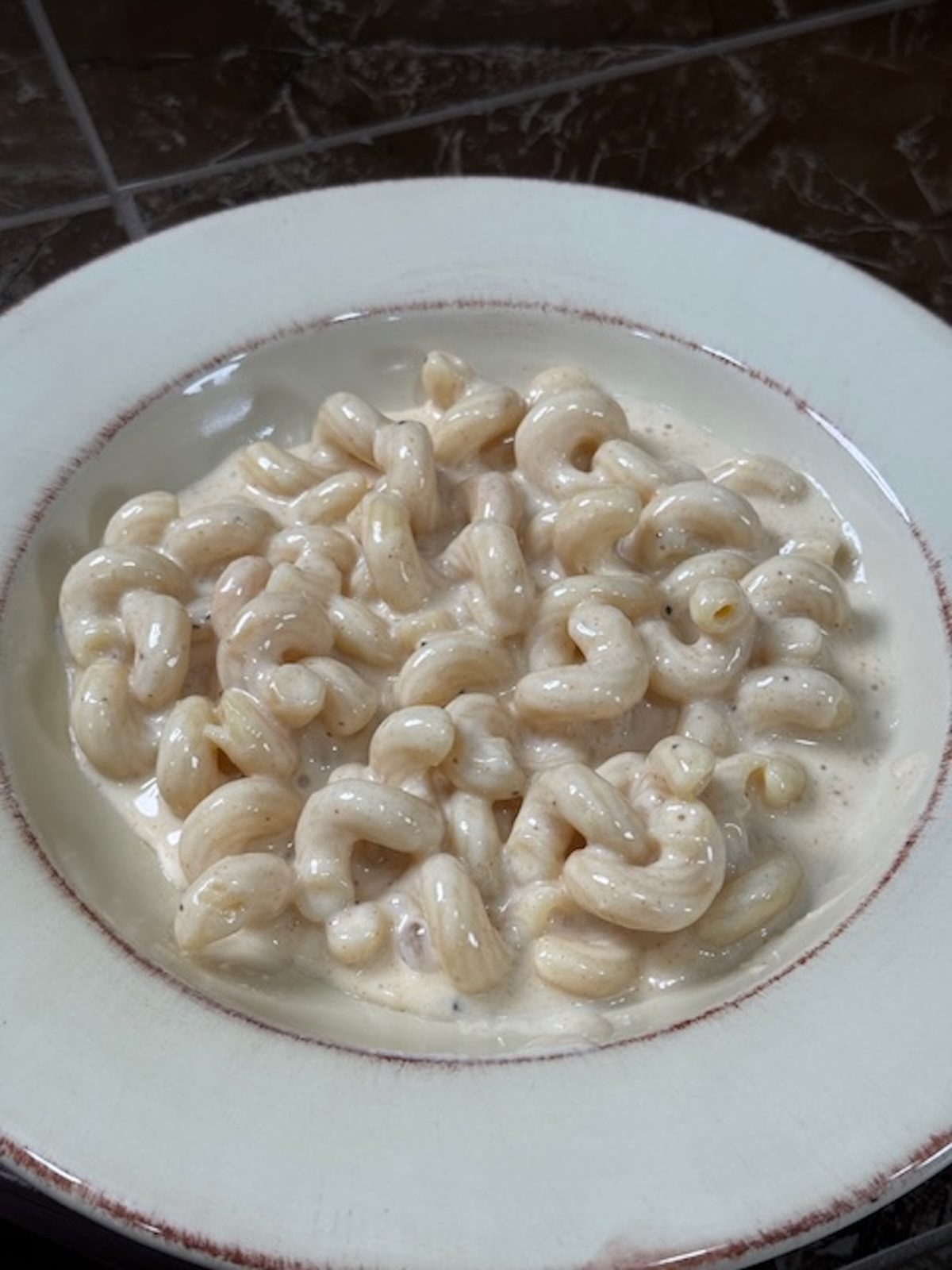 A bowl of finished slow cooker mac and cheese.