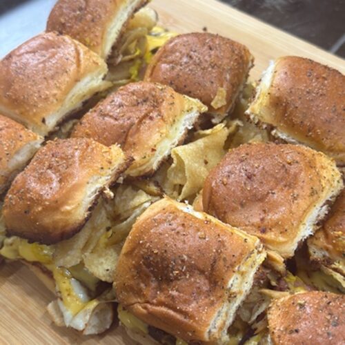 Fried bologna sliders on a cutting board.