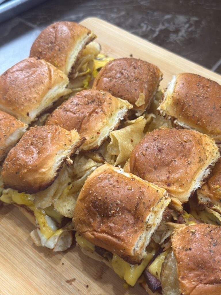 Fried bologna sliders on a cutting board.