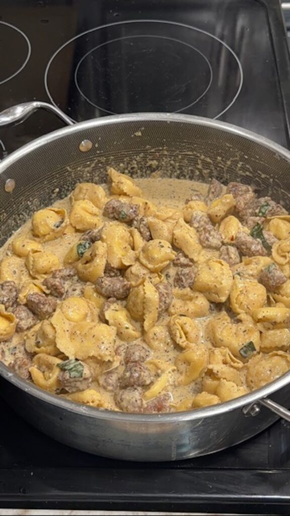 sausage is added to the one stick of butter tortellini in the skillet.