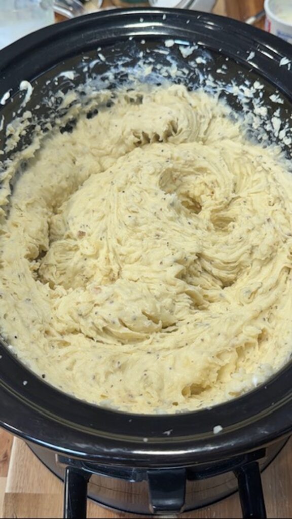Slow cooker mashed potatoes in a crockpot.