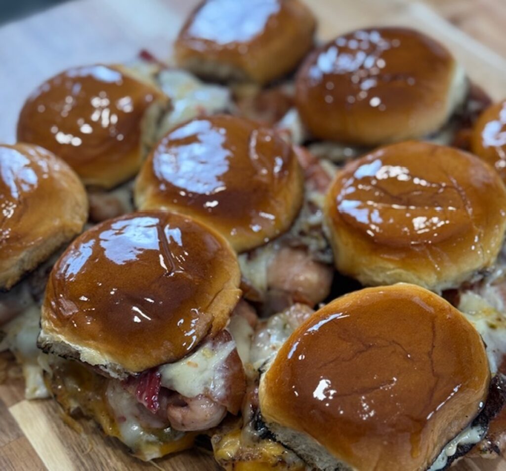 Chicken bacon ranch sliders on a cutting board.