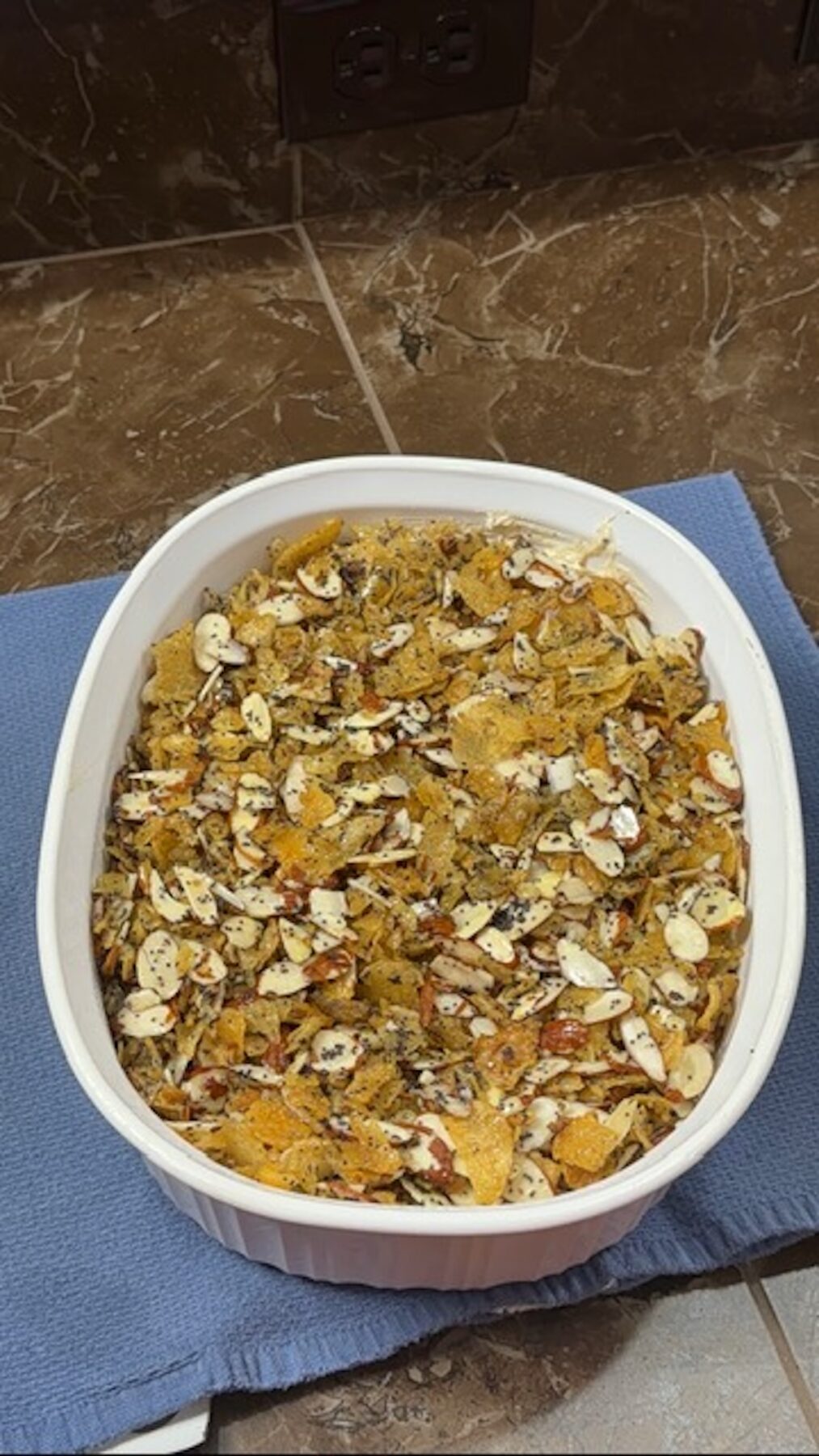 Poppyseed chicken casserole mixture in a white baking dish.