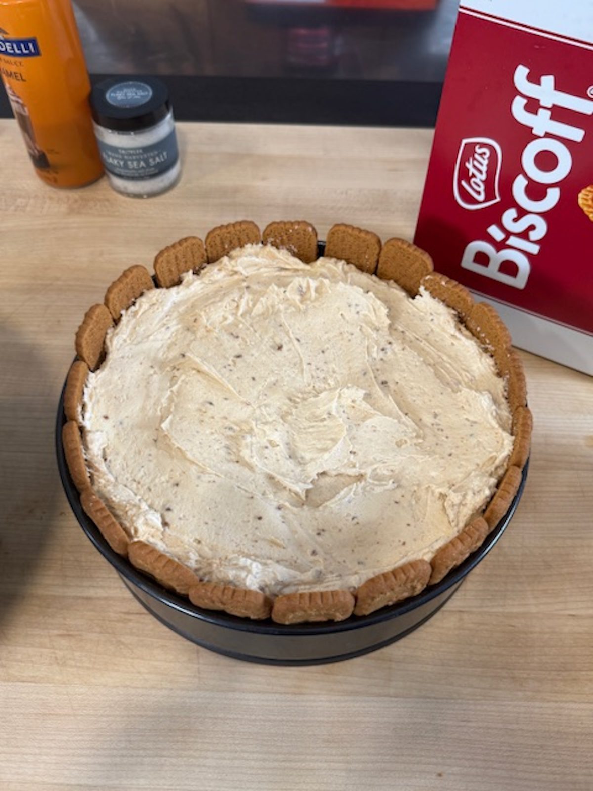 A cake pan with biscoff cookies around the outside with no bake filling on the inside.