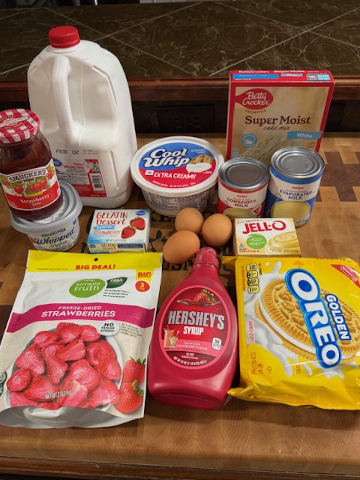 Ingredients for strawberry tres leches cake.