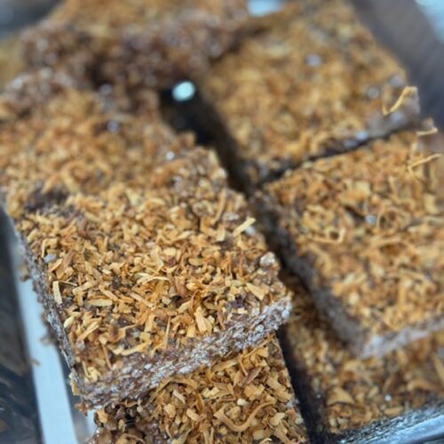 Cut chocolate rice krispie treats stacked on top of each other.