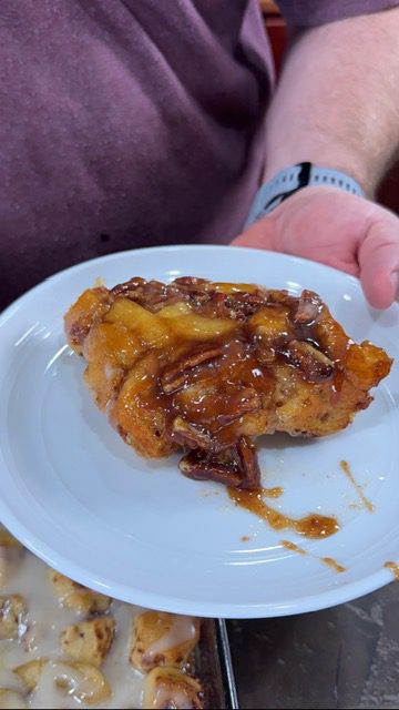A white plate with caramel apple bubble bake.