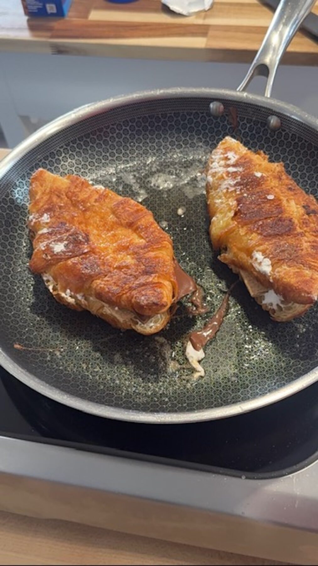 2 smores churros croissants in pan, browning